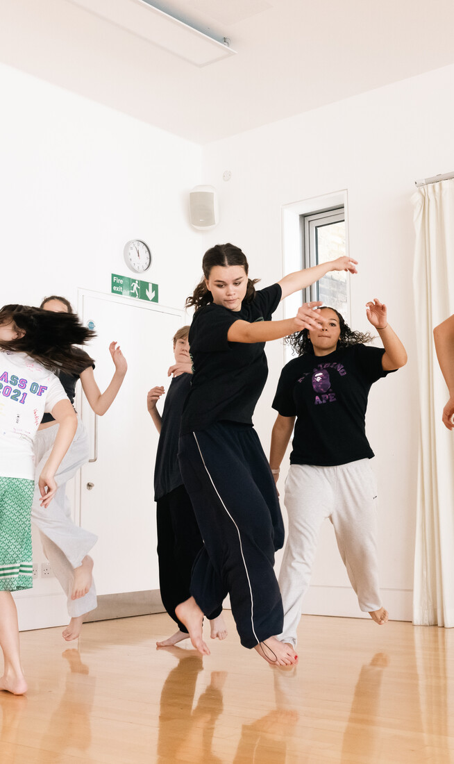 Young people aged approximately 14 spinning in a dance studio