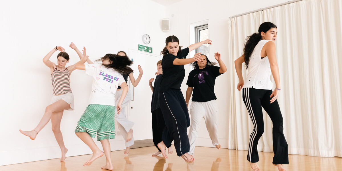 Young people aged approximately 14 spinning in a dance studio