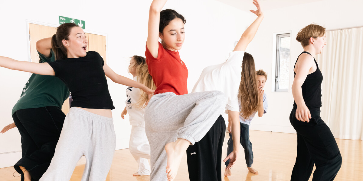 Young dancers aged approximately 13 in a dance studio